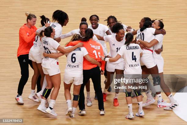 Team France celebrates defeating Team ROC 30-25 to win the gold medal in Women's Handball on day sixteen of the Tokyo 2020 Olympic Games at Yoyogi...