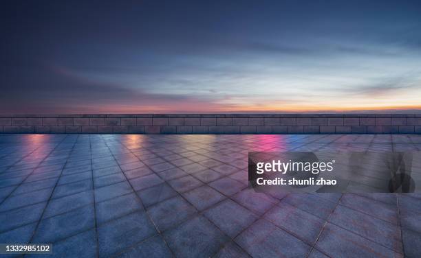 empty ground against cloud sky at night - urban square city night stock pictures, royalty-free photos & images