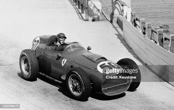 Tony Brooks of Great Britain drives the Ferrari Dino 246 during the Grand Prix of Monaco on 10th May 1959 on the streets of the Principality of...