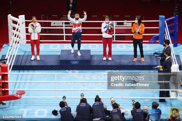 Silver medalist Qian Li of China, gold medalist Lauren Price of Team Great Britain, bronze medalist Zenfira Magomedalieva of Team Russian Olympic...