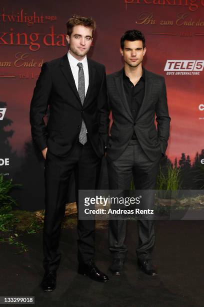 Actors Robert Pattinson and Taylor Lautner attend the Germany Premiere of 'The Twilight Saga: Breaking Dawn Part 1 - Biss zum Ende der Nacht' at...