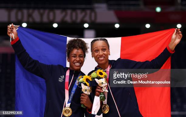 Estelle Nze Minko and Beatrice Edwige of Team France pose with their gold medals during the medal ceremony for Women's Handball on day sixteen of the...