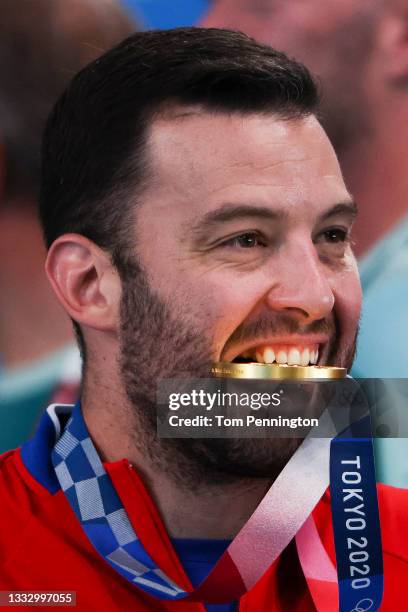 Gold medalist Filip Filipovic of Team Serbia bites his medal after the Men's Gold Medal match between Greece and Serbia on day sixteen of the Tokyo...