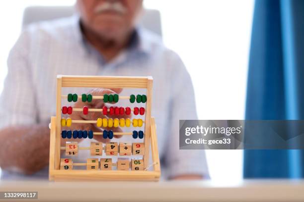 old man make exercise why he is protected alzheimer's disease - abacus old stock pictures, royalty-free photos & images