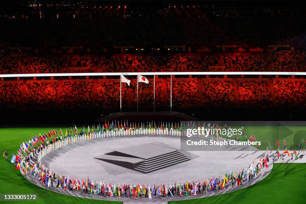 View as the flag bearers of the competing nations enter the stadium during the Closing Ceremony of the Tokyo 2020 Olympic Games at Olympic Stadium on...