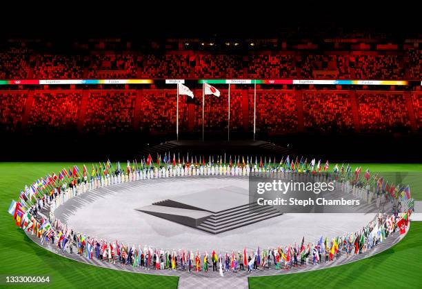 View as the flag bearers of the competing nations enter the stadium during the Closing Ceremony of the Tokyo 2020 Olympic Games at Olympic Stadium on...