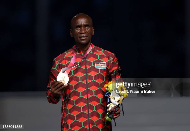 Gold medalist Eliud Kipchoge of Team Kenya poses during the medal ceremony for the Men's Marathon Final during the Closing Ceremony of the Tokyo 2020...