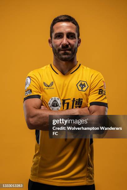 Joao Moutinho of Wolverhampton Wanderers poses for a portrait in the Wolverhampton Wanderers 2021/22 Home Kit at Molineux on August 03, 2021 in...