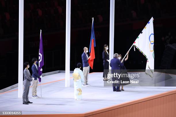 President of the International Olympic Committee, Thomas Bach hands over the Olymmpic flag to Mayor of Paris, Anne Hidalgo during the Closing...