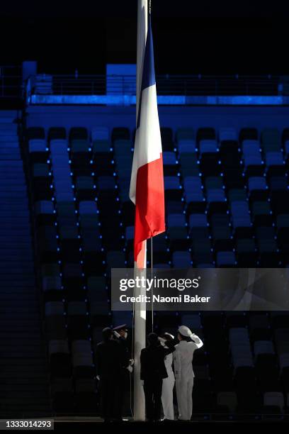 The national flag of France is raised during the Closing Ceremony of the Tokyo 2020 Olympic Games at Olympic Stadium on August 08, 2021 in Tokyo,...