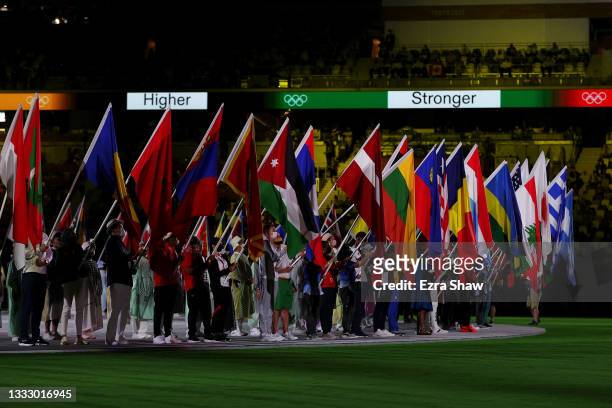 National flag bearers enter the stadium during the Closing Ceremony of the Tokyo 2020 Olympic Games at Olympic Stadium on August 08, 2021 in Tokyo,...