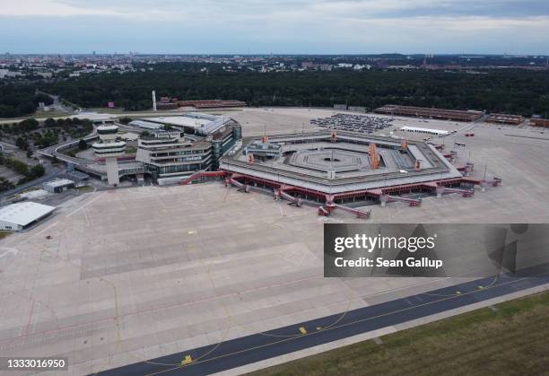 In this aerial view former Tegel Airport stands during a public event on August 07, 2021 in Berlin, Germany. Tegel decommissioned earlier this year...