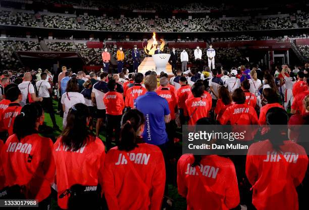 Athletes look on as President of the International Olympic Committee, Thomas Bach speaks during the Closing Ceremony of the Tokyo 2020 Olympic Games...