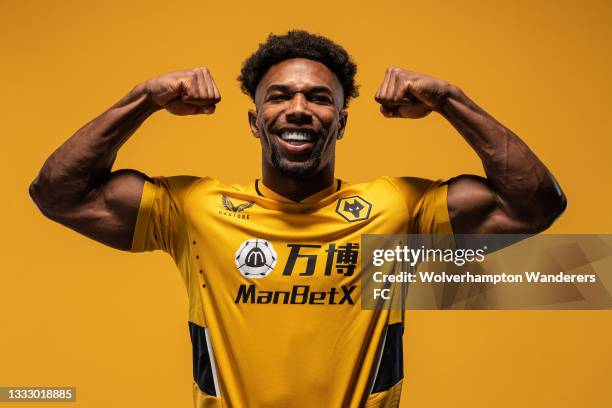 Adama Traore of Wolverhampton Wanderers poses for a portrait in the Wolverhampton Wanderers 2021/22 Home Kit at Molineux on August 03, 2021 in...