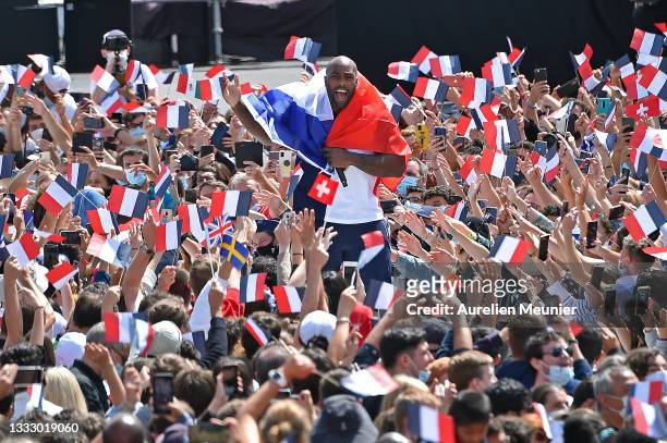 French Olympic medalist Teddy Riner walks through the crowd during the Olympic Games handover ceremony on August 08, 2021 in Paris, France. On August...