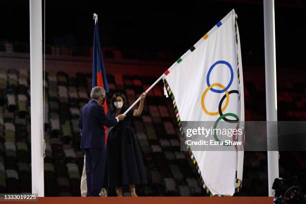 Mayor of Paris, Anne Hidalgo receives the olympic flag from President of the International Olympic Committee, Thomas Bach during the Closing Ceremony...
