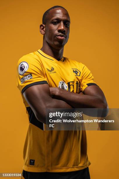 Willy Boly of Wolverhampton Wanderers poses for a portrait in the Wolverhampton Wanderers 2021/22 Home Kit at Molineux on August 03, 2021 in...