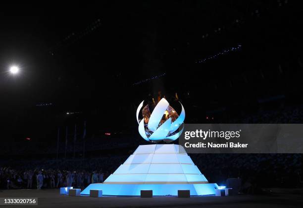 The olympic flame is extinguished during the Closing Ceremony of the Tokyo 2020 Olympic Games at Olympic Stadium on August 08, 2021 in Tokyo, Japan.