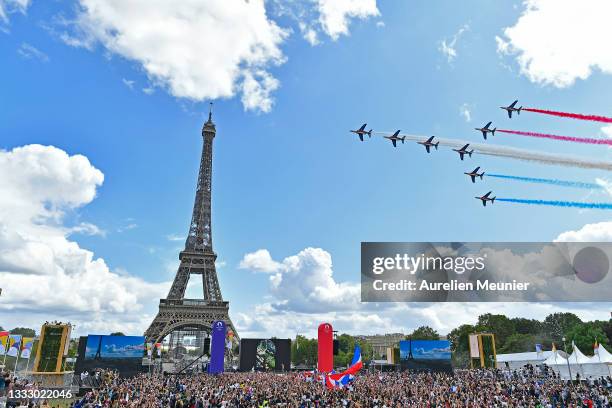 French Elite acrobatic team Patrouille de France flyes over the Eiffel Tower during the Olympic Games handover ceremony on August 08, 2021 in Paris,...