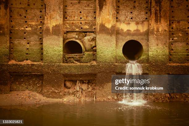 waste water hole - マンホール ストックフォトと画像