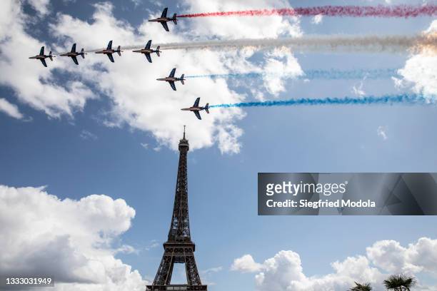 Jets from French air force Patrouille de France fly over the Eiffel Tower during the Olympic Games handover ceremony on August 8, 2021 in Paris,...