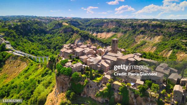 approaching medieval town of civita di bagnoregio from a drone, italy. - latium stock pictures, royalty-free photos & images