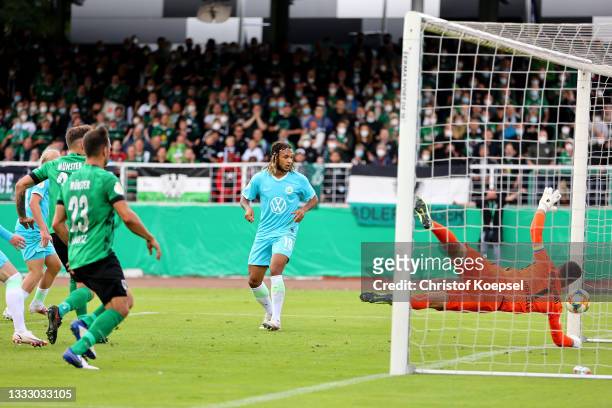 Marcel Hoffmeier of Muenster scores the first goal during the DFB Cup first round match between Preußen Münster and VfL Wolfsburg at Preussen Stadion...