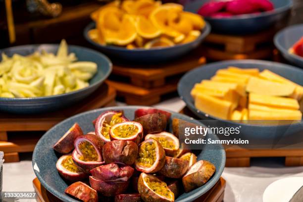 variation of fruits on table - passion fruit imagens e fotografias de stock