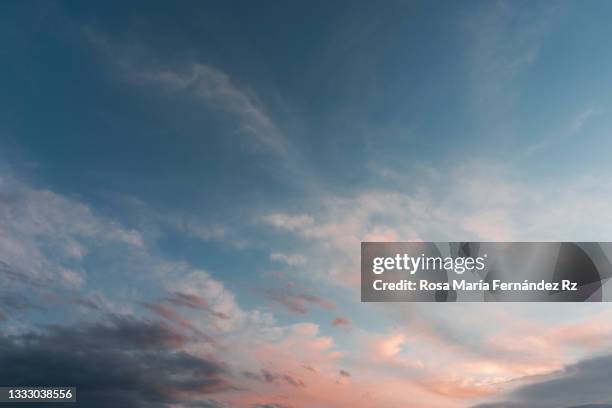 low angle view of clouds in sky during sunset. - 空のみ ストックフォトと画像