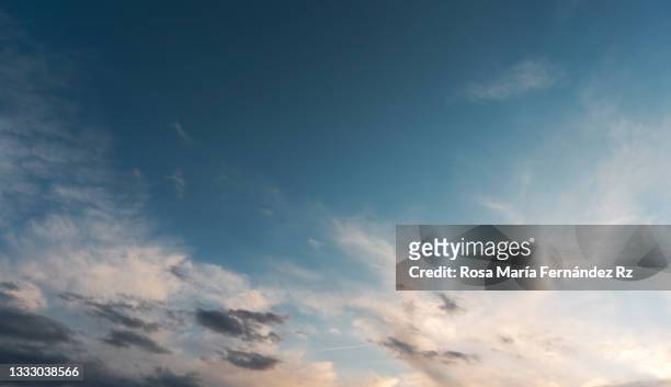 low angle view of clouds in sky during sunset. - 巻雲 ストックフォトと画像