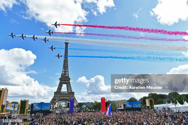 French Elite acrobatic team Patrouille de France flyes over the Eiffel Tower during the Olympic Games handover ceremony on August 08, 2021 in Paris,...