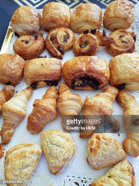 an assortment of kosher french pastries, croissant, chocolate croissant, raisin bread, apple turnover - boulangerie paris stock pictures, royalty-free photos & images