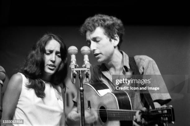 American singer-songwriter, musician, and author Bob Dylan is accompanied by American folk singer Joan Baez during Dylan's iconic performance at the...