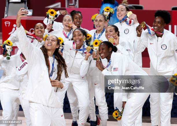 Brittney Griner of USA takes a selfie with teammates during the medal ceremony of the Women's Basketball Gold Medal Final between United States and...