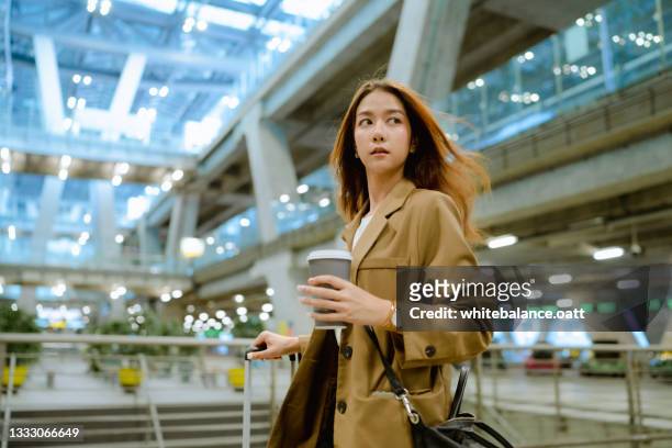 business woman is walking inside the terminal. - passport control stock pictures, royalty-free photos & images
