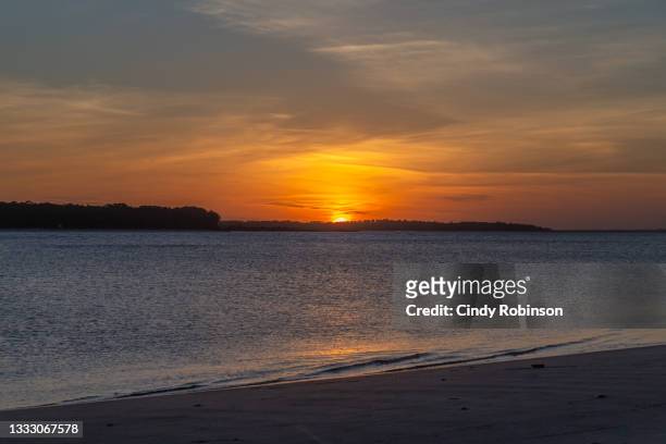 sunset on the coast - southeast stock pictures, royalty-free photos & images