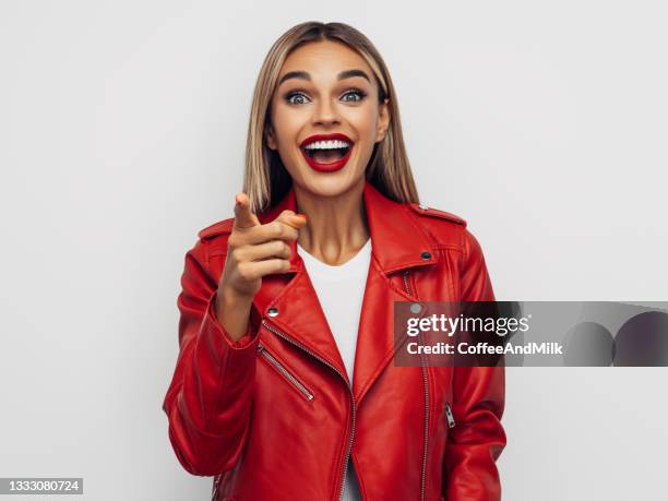 young happy emotional girl - red jacket stock pictures, royalty-free photos & images