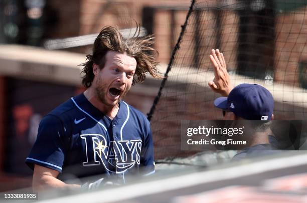 Brett Phillips of the Tampa Bay Rays celebrates after hitting a grand slam in the eighth inning against the Baltimore Orioles at Oriole Park at...