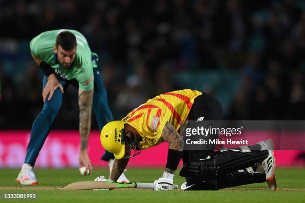 Alex Hales of Trent Rockets Men is hit in the most painful spot for the second ball in a row from Reece Topley of Oval Invincibles Men during The...