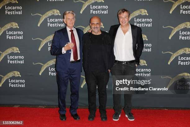 President of Locarno Film Festival Marco Solari, director Gaspar Noé and Olivier Père attend the red carpet during the 74th Locarno Film Festival on...
