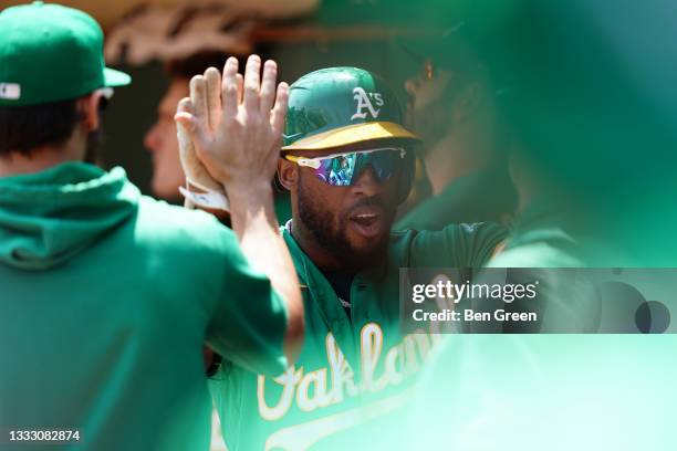 Starling Marte of the Oakland Athletics celebrates after scoring in the first inning against the Texas Rangers at RingCentral Coliseum on August 08,...