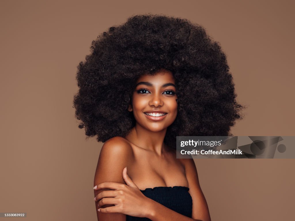 Beautiful girl with curly hairstyle