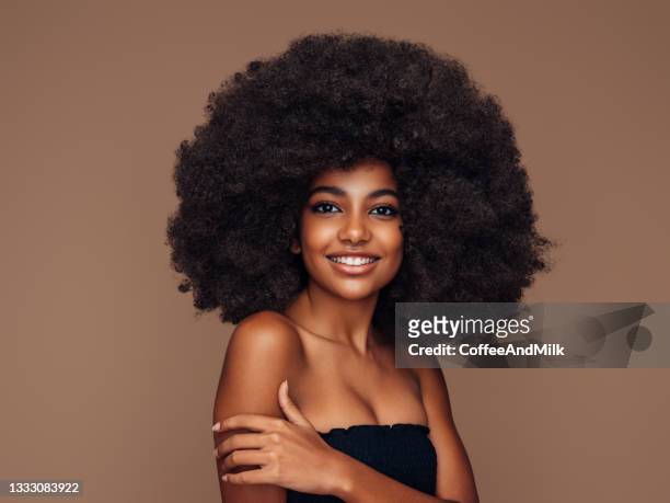 beautiful girl with curly hairstyle - afro hairstyle stock pictures, royalty-free photos & images