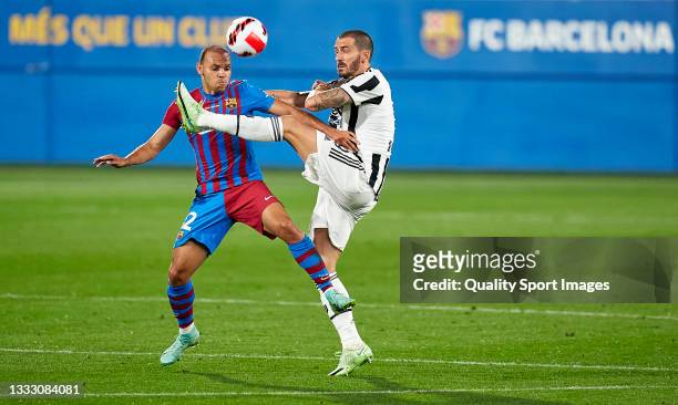 Martin Braithwaite of FC Barcelona competes for the ball with Leonardo Bonucci of Juventus during the Joan Gamper Trophy match between FC Barcelona...