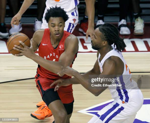 Scottie Barnes of the Toronto Raptors drives against Wayne Selden of the New York Knicks during the 2021 NBA Summer League at the Thomas & Mack...