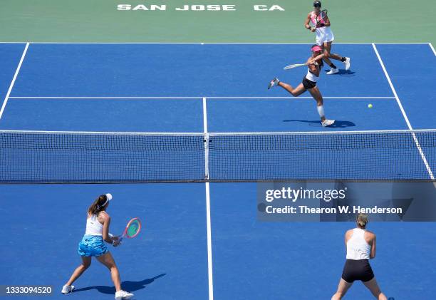 Andreja Klepac of Slovenia, playing with Darija Jurak of Croatia, returns a shot against Gabriela Dabrowski of Canada and Luisa Stefani of Brazil in...