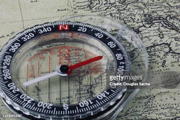 liquid-filled protractor orienteering compass for navigation - map journey stock pictures, royalty-free photos & images