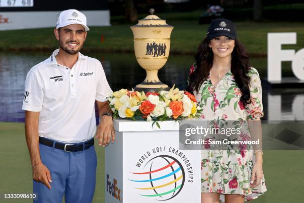 Abraham Ancer of Mexico and girlfriend Nicole Curtright pose with the trophy after Ancer won the FedEx St. Jude Invitational after the second playoff...