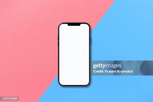 smartphone on pink and blue background for display product or text - apple white background stock-fotos und bilder