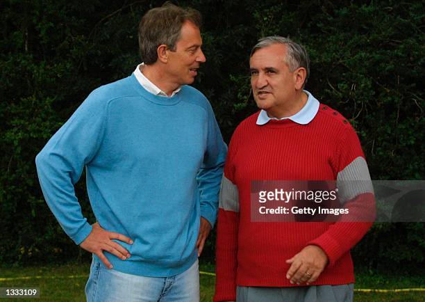 British Prime Minister Tony Blair and his French counterpart Jean-Pierre Raffarin are shown at La Grezette Castle August 12, 2002 near Cahors in...